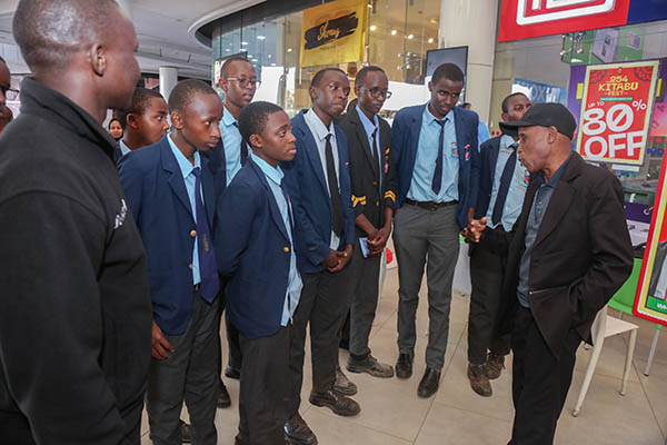 John Kiriamiti chats with high school students