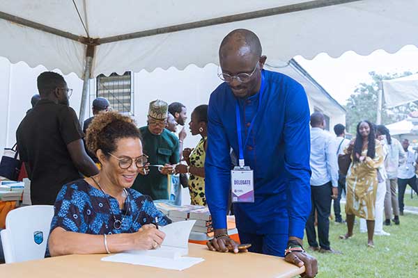 Aminatta Forna signs a book for a fan.