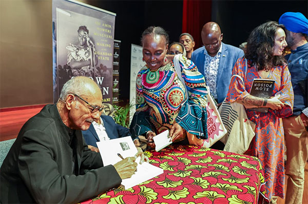 Mahmood Mamdani signs books